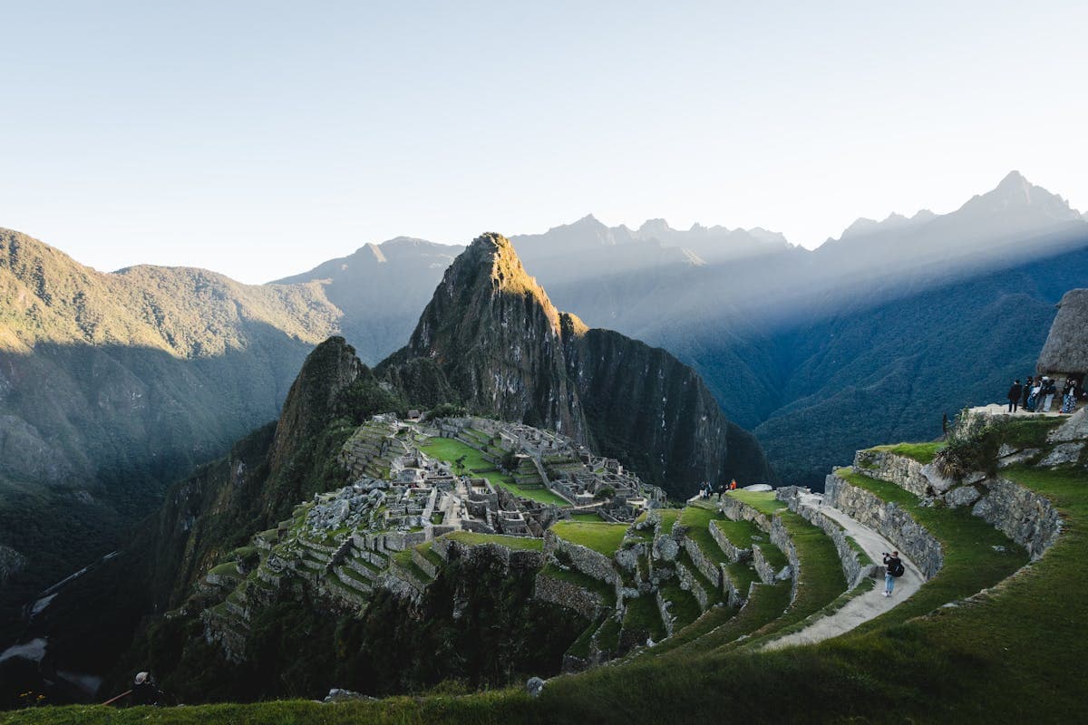 Dramatic mountain landscape at sunrise with misty peaks